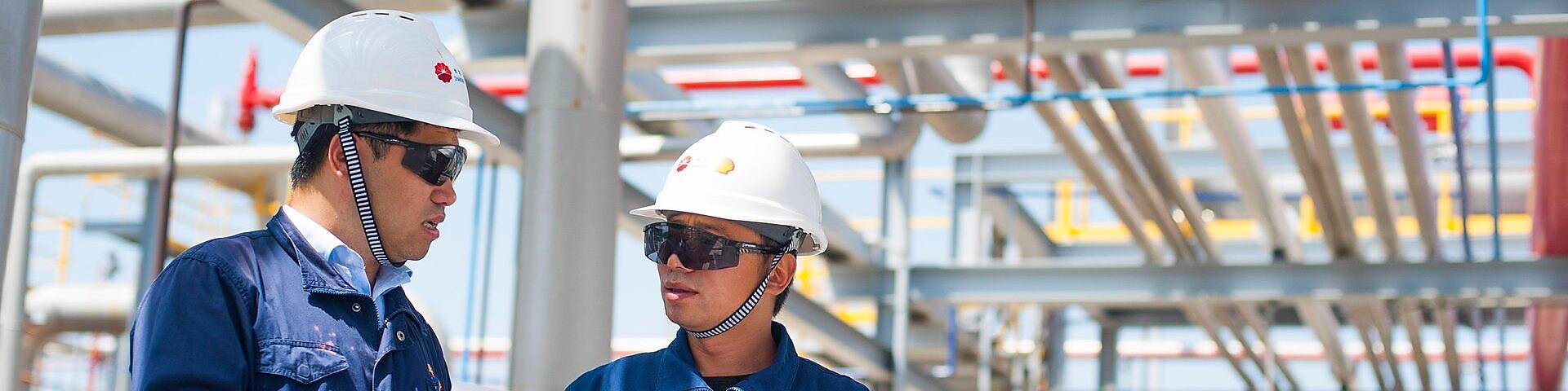 Two Shell employees working at a processing facility in China