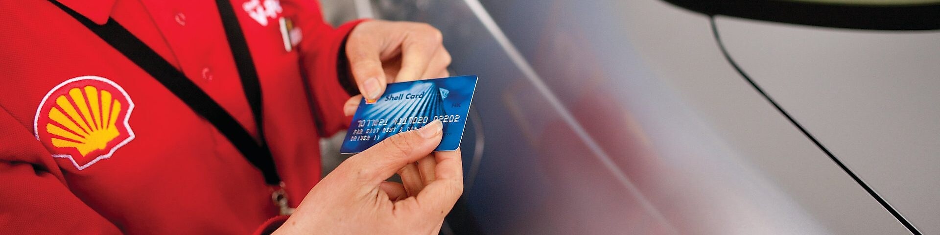 woman with Shell card at Retail site