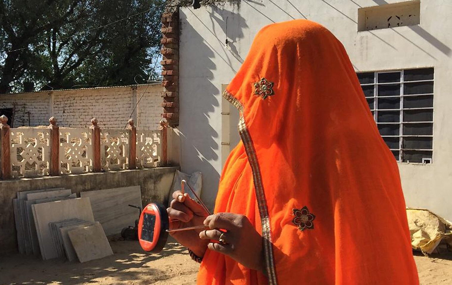 A meeting where women learn how to light their homes