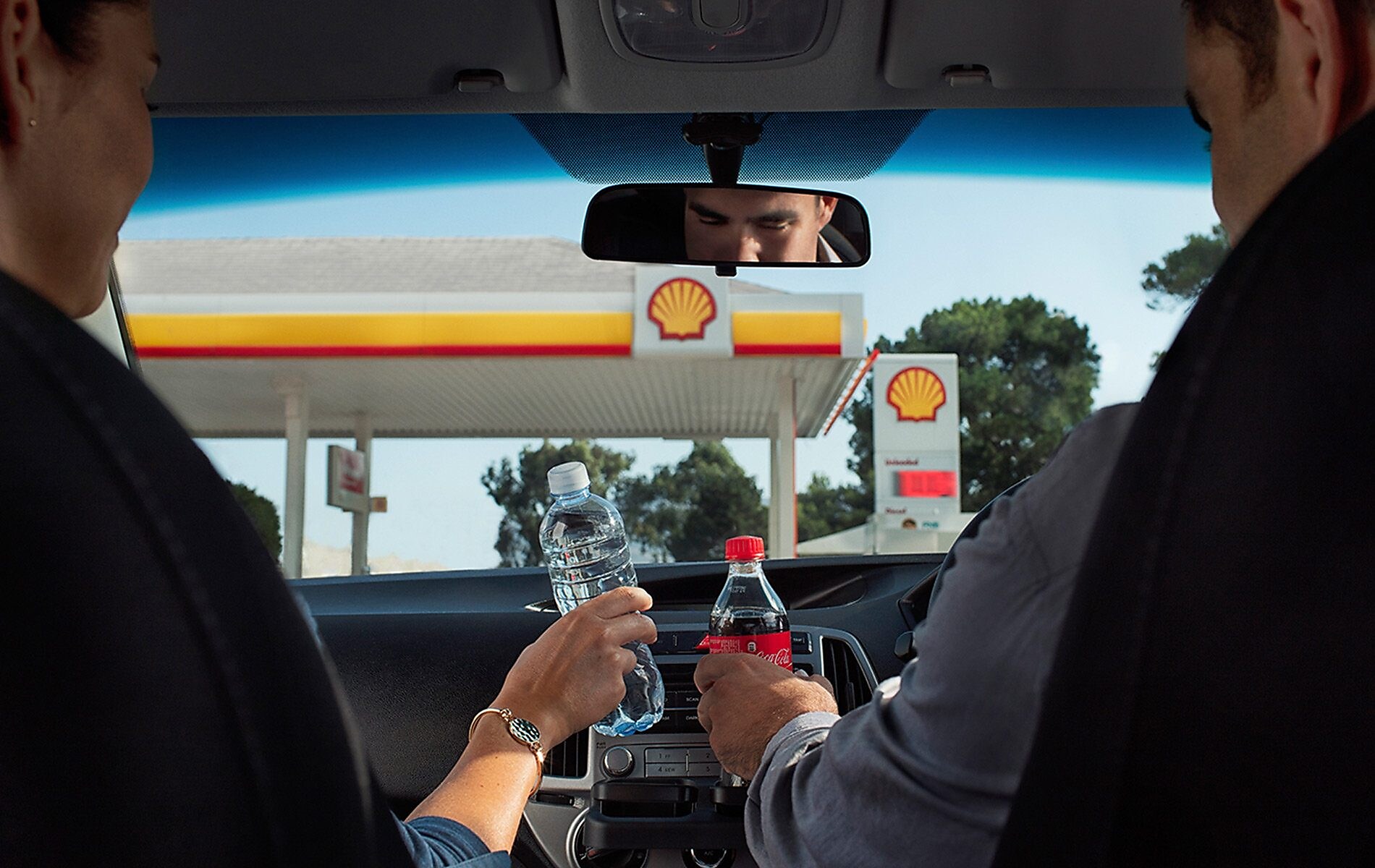 friends drinking in car